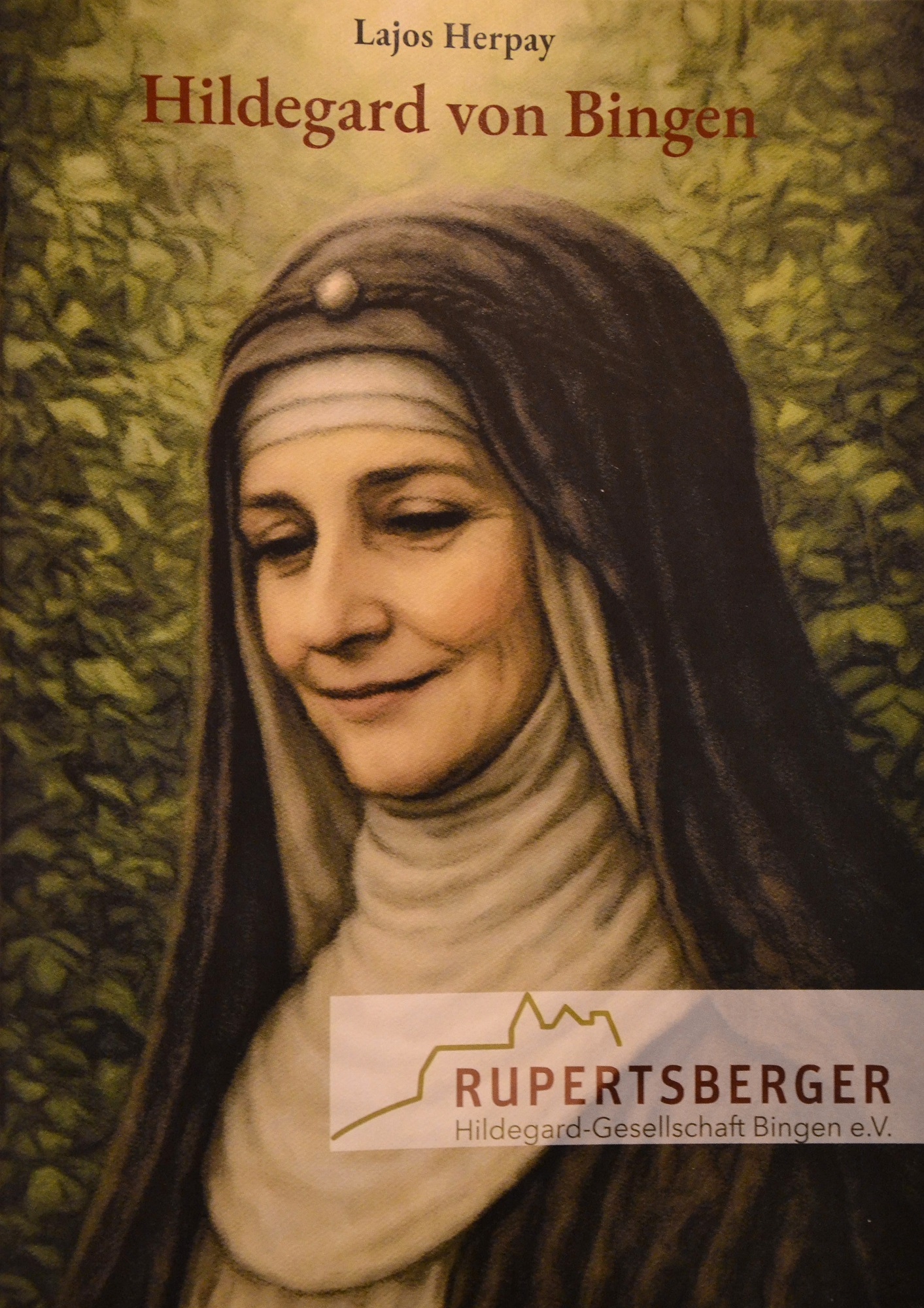 Die 70‑seitige, reich bebilderte Publikation ist kostenlos bei der Rupertsberger Hildegard‑Gesellschaft (https://rupertsberger-hildegardgesellschaft.de) erhältlich. Buch-Cover: Hildegard von Bingen